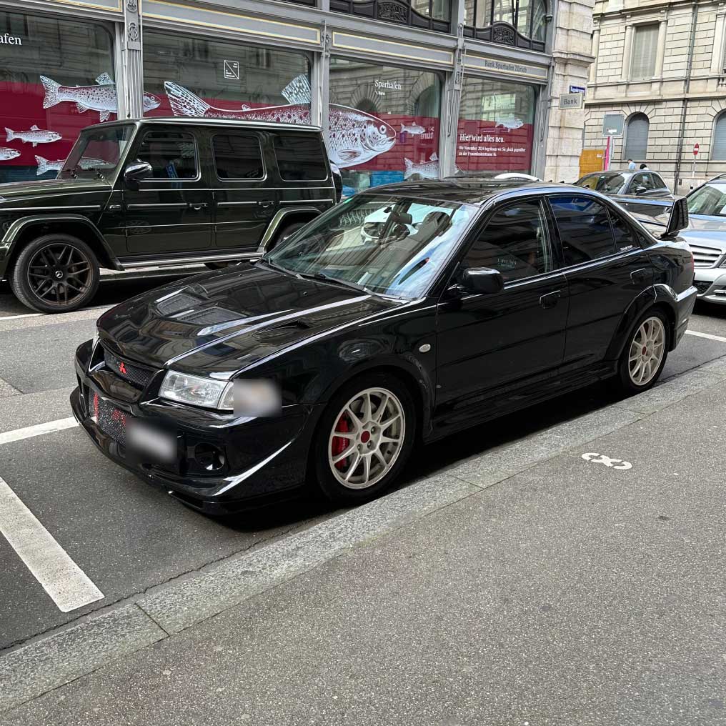 Mitsubishi Lancer Evolution VI: The Rally Legend with Iconic Spoiler and Turbocharged Power